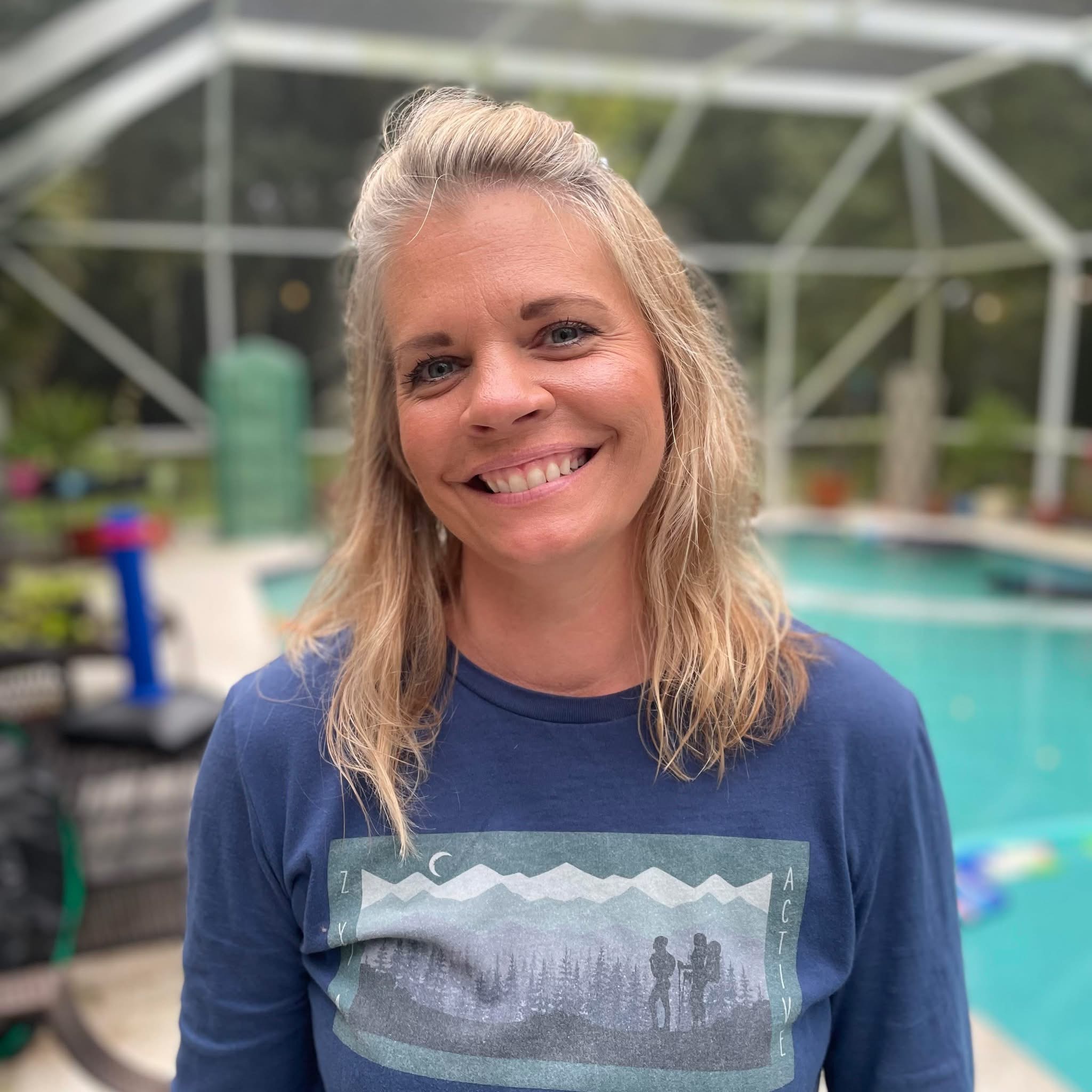 Amber Laird, Forensic QuickBooks Cleanup Specialist, outdoors by the water